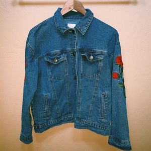 jean jacket with rose patches on the sleeves
